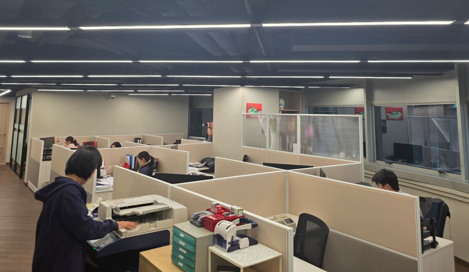 The YITAC office in Woodlands: engineers and project staff at work across an open-plan floor.